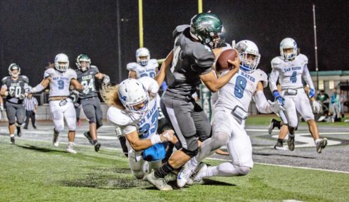 CSM linebacker Bubba Palu, right, and defensive back Trey Smith stop Laney QB Jordon Brookshire on an attempt for a two-point conversion last Friday night in Oakland. Photo by Lauren Anderson.