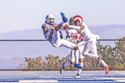 CSM receiver Mason Starling hauls in a 13-yard scoring pass in the third quarter en route to a career-high 154 receiving yards and three TD catches in the Bulldogs’ Northern California regional semifinal victory Saturday at College Heights Stadium. Photo by Patrick Nguyen.