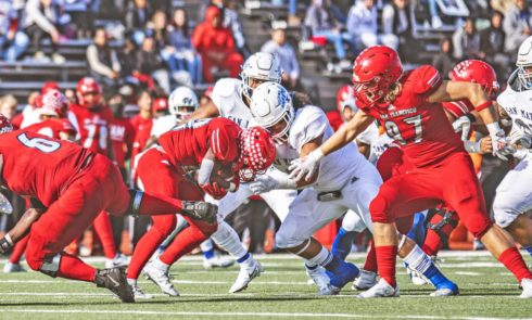 CCSF running back Shawn Allen collides with CSM defensive tackle Noah Lavulo in the CCCAA Nor Cal title game Saturday at George Rush Stadium. Photo by Patrick Nguyen.